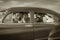 Family Waving Hello in Vintage Car