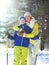 Family winter healthy lifestyle! Mother and son child go skiing in forest