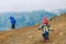 Family winter travel - little girl and boy hiking in mountains