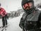 Family on winter vacations taking selfie on mountain slope