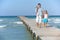 Family on wooden jetty