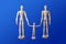 Family - wooden toy figures on blue