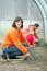 Family works in greenhouse