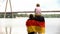 Family wrapped in German flag looking at bridge, immigration, independence day