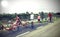 Family with young boys and little girl with bike on the road