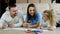 Family young parents drawing coloring picture with pencils cute child daughter