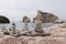 Famous Afroditi beach in Cyprus. Constructions of stones Opposite Aphrodite hill. Forbidden bathing. Childhood. Wonderful pyramid