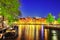 Famous Amstel river and night view of beautiful Amsterdam city.