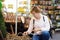 The famous Amsterdam flower market Bloemenmarkt. Mature women choose flower bulbs.