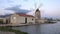 Famous ancient windmill of Riserva Naturale Saline Visitor Centre in Trapani, Sicily, Italy. It is producing sea salt using evapor