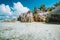 Famous Anse Source d`Argent beach on La Digue island, Seychelles. Huge surreal shaped granite boulders on tropical coast