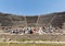 The famous archaeological site of Pompeii UNESCO heritage. Crowd of tourists under the scorching sun