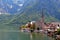 Famous Austria village Hallstatt with church and lake