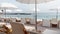 The famous beach Larvotto of principality of Monaco in sunny day, sun umbrellas, palm trees, azure water