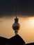 The famous Berlin TV tower behind a fountain on Berlin`s Alexanderplatz