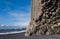 The famous Black Sand ocean Beach, mount Reynisfjall and Picturesque Basalt Columns, Vik, South Iceland. Dyrholaey Cape and rock