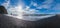 The famous Black Sand ocean Beach panorama. Mount Reynisfjall with Picturesque Basalt Columns and Dyrholaey Cape in far right. Vik