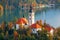 Famous Bled Lake in Triglav National Park in the Julian Alps with a forest in autumn colors