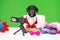 famous blogger dachshund dog in jacket and shirt sit at table in front of camera making review of toys for pets for