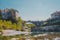 Famous bridge on Kanal ob Soci village during hot summer day with cold Soca river flowing below the bridge. Frog view of a bridge