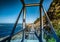 Famous bridge over Storms River Mouth at the Indian Ocean