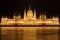 Famous Budapest parliament at the river Danube at night from the