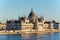 Famous Budapest parliament at the river Danube during sunset fro