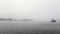 Famous buildings of Amsterdam city centre at foggy day. General landscape view of city embankment with rush boats. Time Lapse.