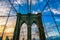 Famous busy Brooklyn bridge in New York under the colorful sky