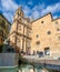 Famous Casa de las Conchas with La Clerecia Church in Salamanca,