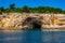 The famous caves of Votsi beach area in eastern Alonissos as seen during boating in Alonissos island, Greece