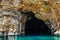 The famous caves of Votsi beach area in eastern Alonissos as seen during boating in Alonissos island, Greece