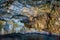 The famous caves of Votsi beach area in eastern Alonissos as seen during boating in Alonissos island, Greece