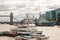 Famous cityscape view of London. Forecast Thames river traffic full of nautical ships with amazing Tower bridge on the background