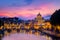 Famous cityscape view of St Peters basilica in Rome at sunset