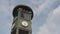 Famous Clock At Potsdamer Platz In Berlin, Germany With Fast Moving Clouds