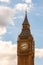 Famous clock tower of Big Ben is a classic symbol of London with sunny sky on the background