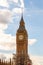 Famous clock tower of Big Ben is a classic symbol of London with sunny sky on the background