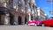 Famous colorful Taxis in Havana waiting for tourists to take a ride in a vintage car around