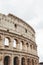 famous Colosseum ruins on cloudy day,