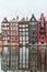 Famous dancing houses and buildings in Amsterdam with reflection in canal water