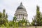 Famous dome of Utah State Capitol Building against cloudy sky in Salt Lake City