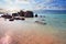 Famous Elafonissi beach in the morning light. Amazing sunrise view with pink sand, blue sea and clouds sky