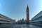 Famous empty San Marco square with Basilica of Saint Mark and Bell Tower at sunrise,Venice,Italy.Early morning at popular tourist