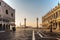 Famous empty San Marco square with Doges Palace at sunrise,Venice,Italy.Early morning in popular tourist destination.World famous