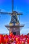 Famous European Places. Variety of Blooming Colorful Tulips In Keukenhof Public Flower Garden With Traditional Dutch Windmill In