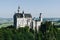 Famous fairytale Neuschwanstein castle on top of the mountain in Bavarian Alps in Germany