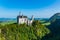 Famous fairytale Neuschwanstein castle on top of the mountain in Bavarian Alps in Germany