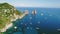 The famous Faraglioni of the island of Capri in Italy, Gulf of Naples. Aerial view of the most visited exclusive three