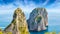 Famous Faraglioni Rocks near Capri Island, Italy. Beautiful paradise landscape with azure sea in summer sunny day